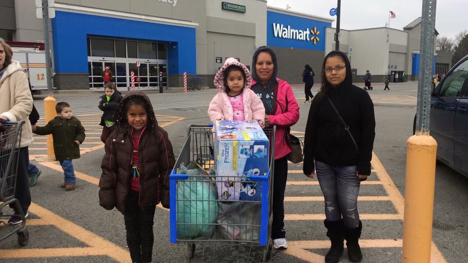 Family gifted with Christmas shopping from Shop With a Hero